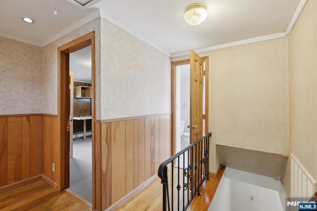 27 Jagoe Street Bergenfield, NJ 07621 - Photo 24 of 44 a view of a hallway with wooden floor and entryway