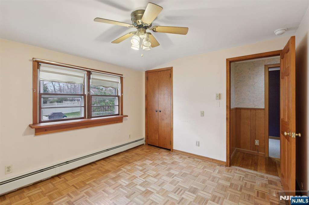 27 Jagoe Street Bergenfield, NJ 07621 - Photo 32 of 44 an empty room with windows and fan