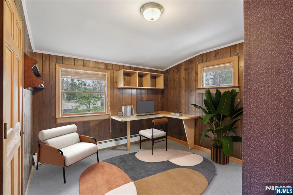 27 Jagoe Street Bergenfield, NJ 07621 - Photo 33 of 44 a living room with furniture a window and a potted plant