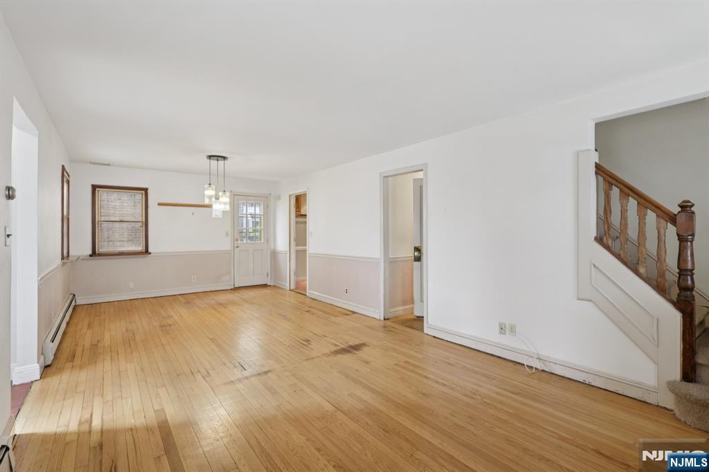 27 Jagoe Street Bergenfield, NJ 07621 - Photo 8 of 44 a view of an empty room and wooden floor