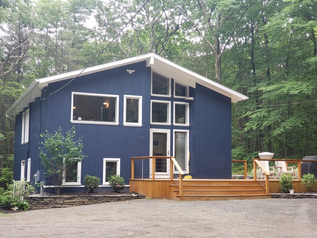 28 Butterhill Road Pelham, MA 01002 - Photo 1 of 42 a front view of a house with a yard