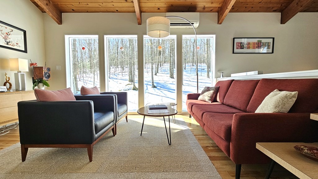 28 Butterhill Road Pelham, MA 01002 - Photo 4 of 42 a living room with furniture and a large window