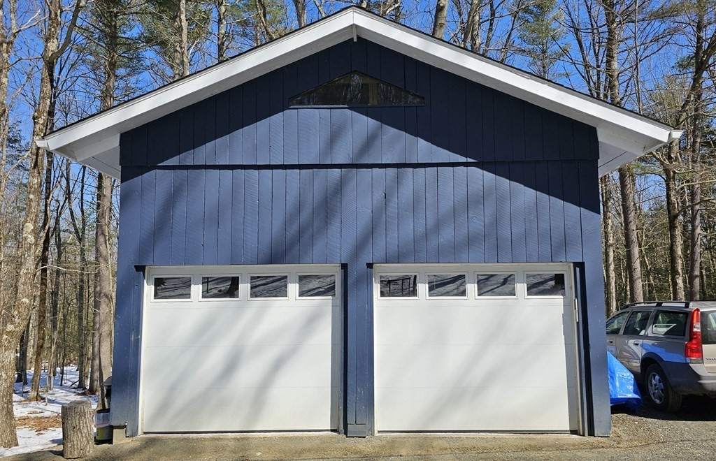 28 Butterhill Road Pelham, MA 01002 - Photo 41 of 42 a black and white building with black door