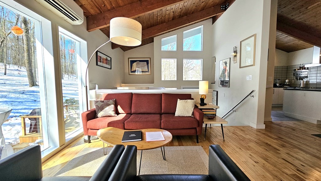 28 Butterhill Road Pelham, MA 01002 - Photo 7 of 42 a living room with furniture and a large window
