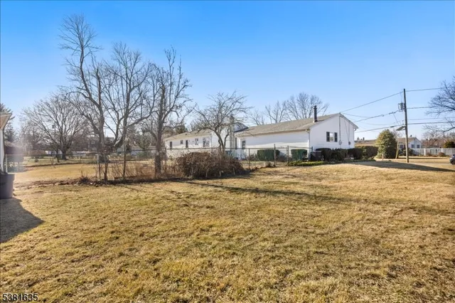 a large tree in front of a house