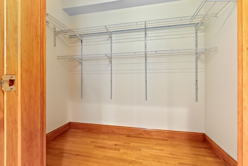 50 Maple Street, Unit 5 Danvers, MA 01923 - Photo 15 of 21 a view of an empty room with wooden floor