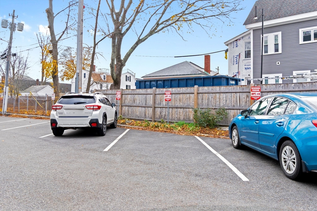 50 Maple Street, Unit 5 Danvers, MA 01923 - Photo 20 of 21 a view of a car parked in front of a house