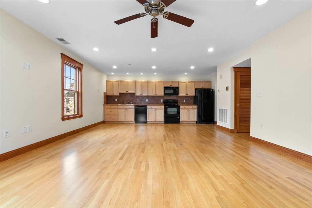 50 Maple Street, Unit 5 Danvers, MA 01923 - Photo 9 of 21 a view of empty room with wooden floor