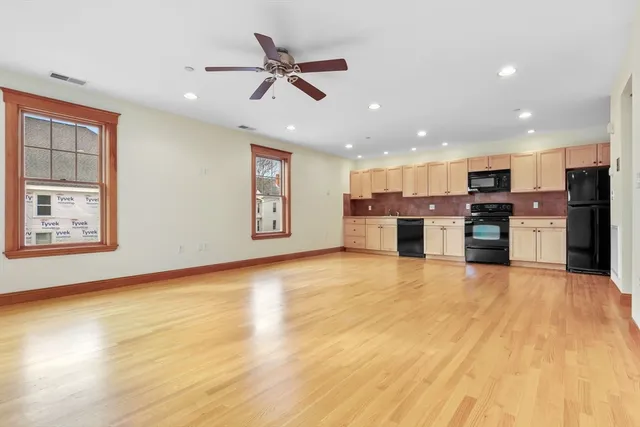 a view of kitchen and stainless steel appliances refrigerator oven