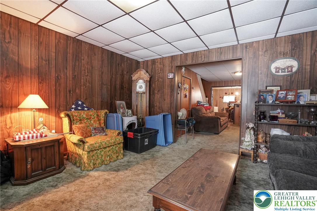335 West Patterson Street Lansford, PA 18232 - Photo 12 of 32 a living room with furniture and a chandelier