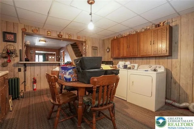 a kitchen with a cabinets and wooden floor