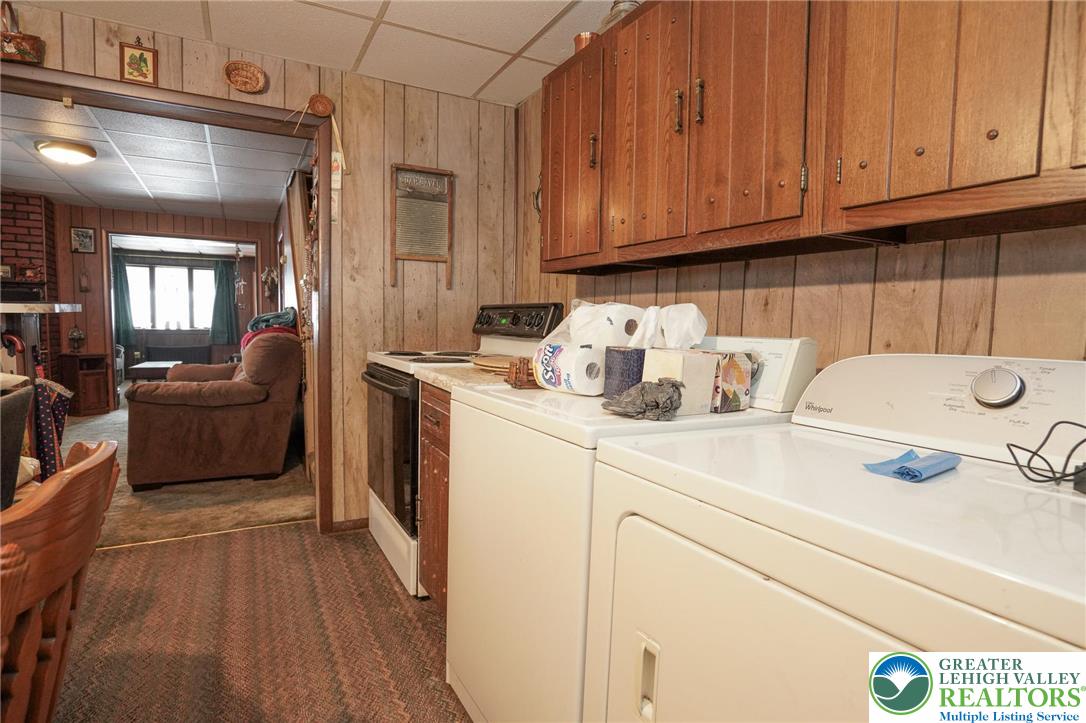 335 West Patterson Street Lansford, PA 18232 - Photo 22 of 32 a kitchen with a cabinets and wooden floor