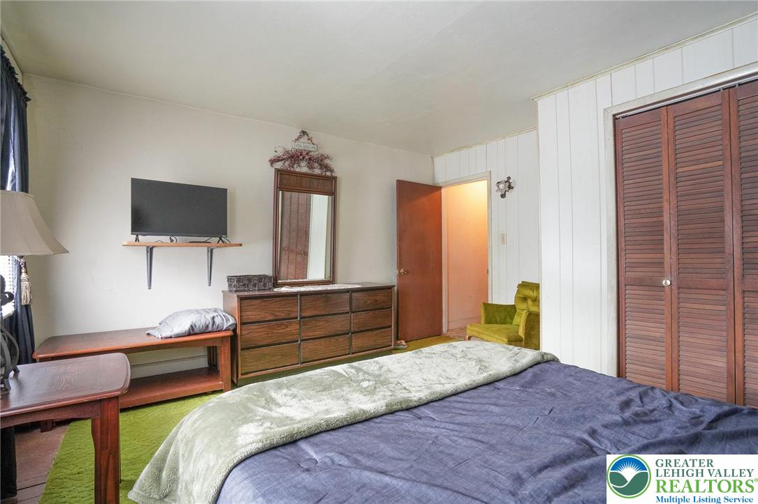 335 West Patterson Street Lansford, PA 18232 - Photo 25 of 32 a bedroom with a bed and a flat screen tv