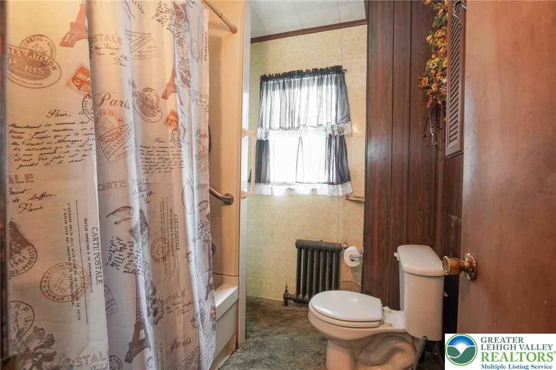 335 West Patterson Street Lansford, PA 18232 - Photo 27 of 32 a bathroom with a toilet and a shower curtain