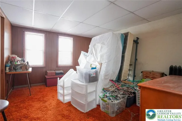 a workspace room with furniture