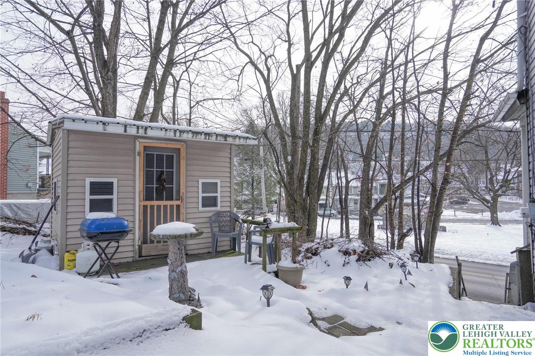 335 West Patterson Street Lansford, PA 18232 - Photo 8 of 32 a view of a dinning table and chairs in the patio of snow