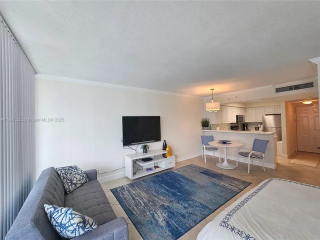 a kitchen with a table and chairs in it