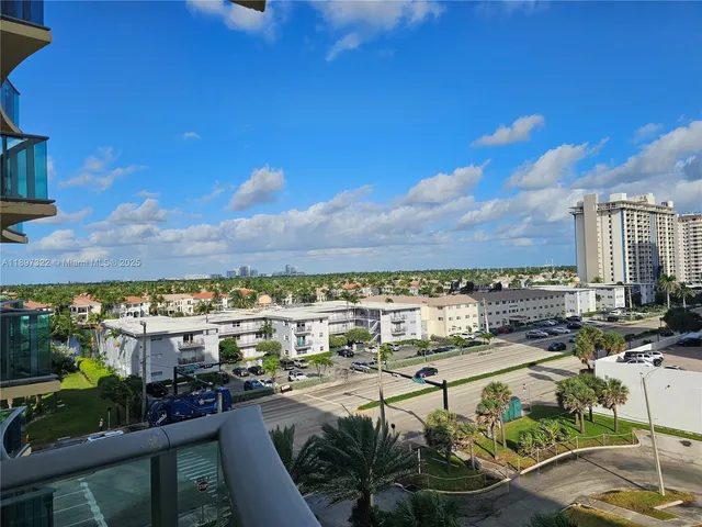 a view of a livingroom with furniture and a window