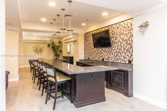 a view of a living room and a chandelier