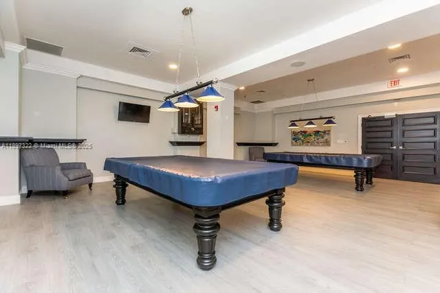 a view of a living room and kitchen