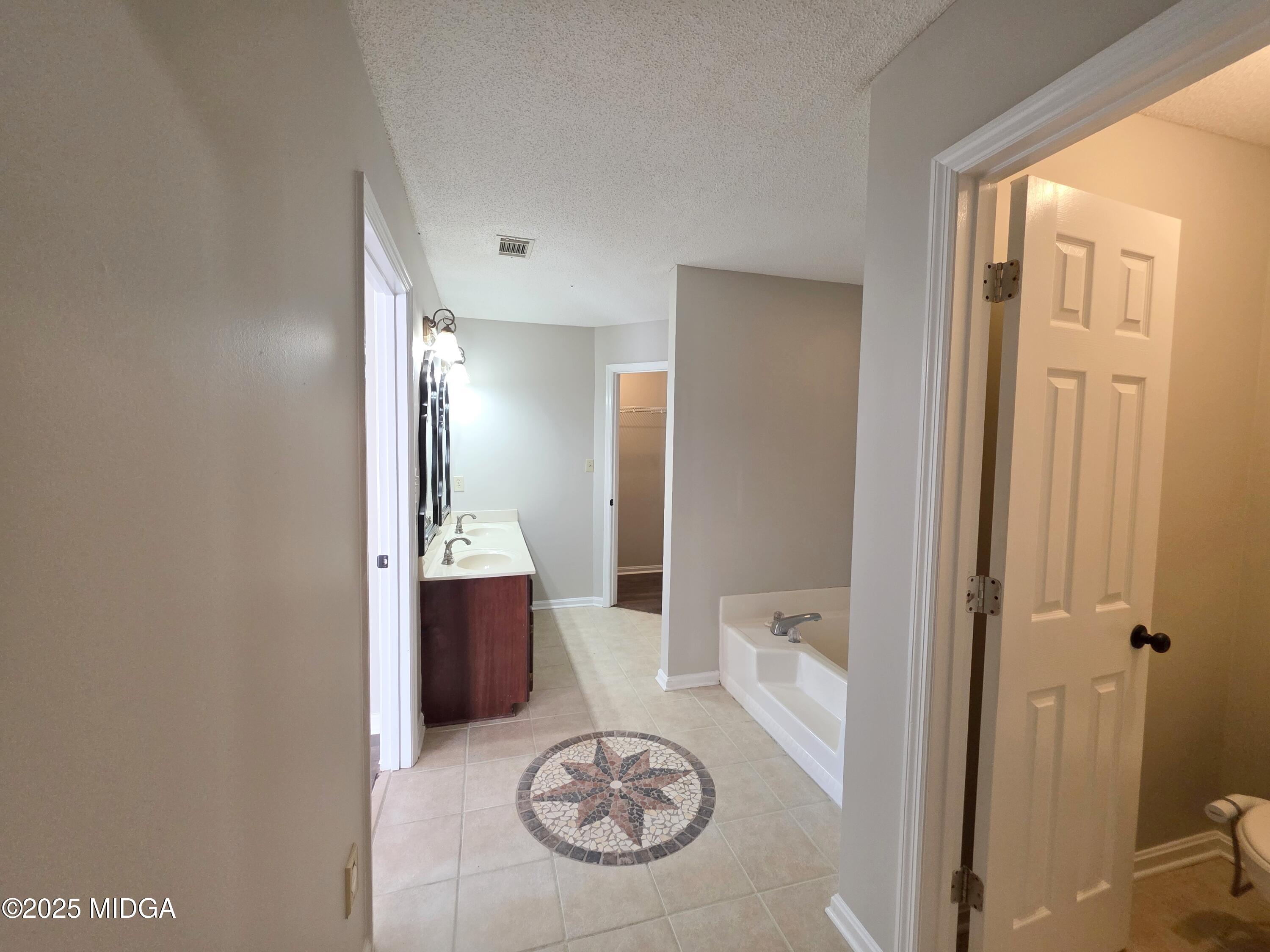 307 Pheasant Ridge Drive Warner Robins, GA 31088 - Photo 24 of 39 a bathroom with a tub shower and sink