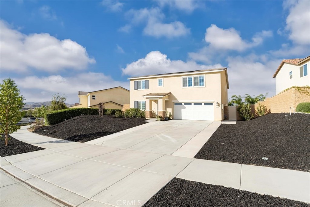 32078 Rambling Court Winchester, CA 92596 - Photo 9 of 48 a view of a house with a yard