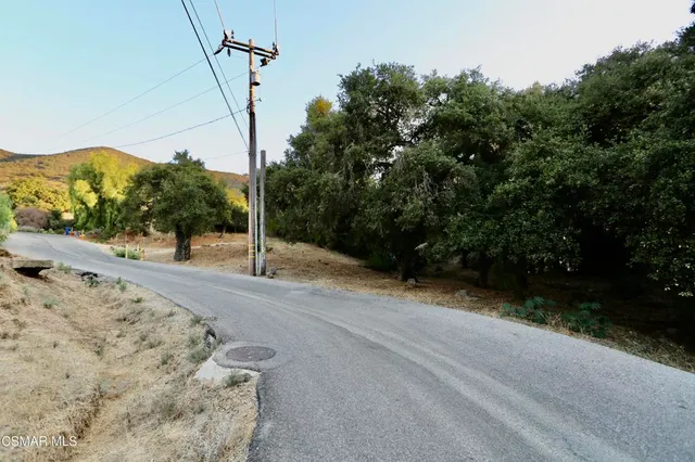 a view of a road with a building in the background