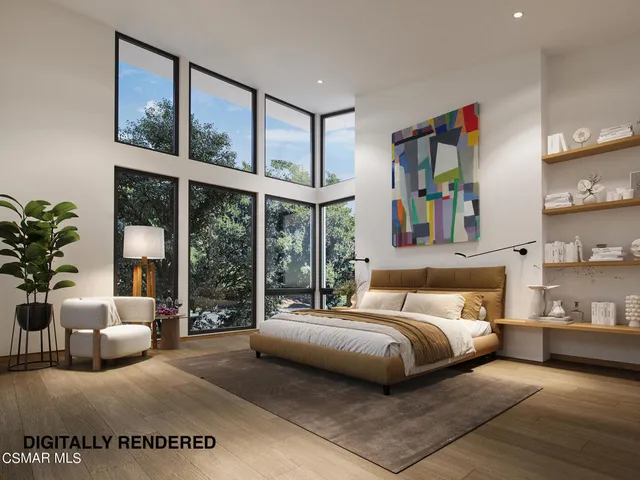 a bedroom with a large bed and a large window