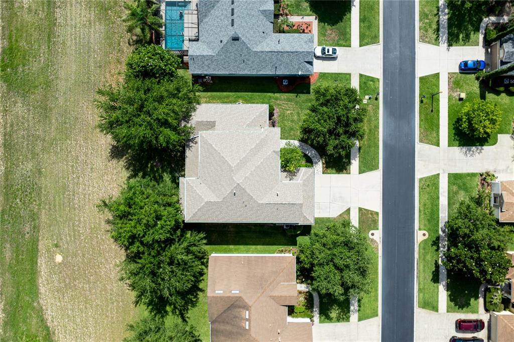 2718 Knightsbridge Road Clermont, FL 34711 - Photo 68 of 72 an aerial view of a house with a garden