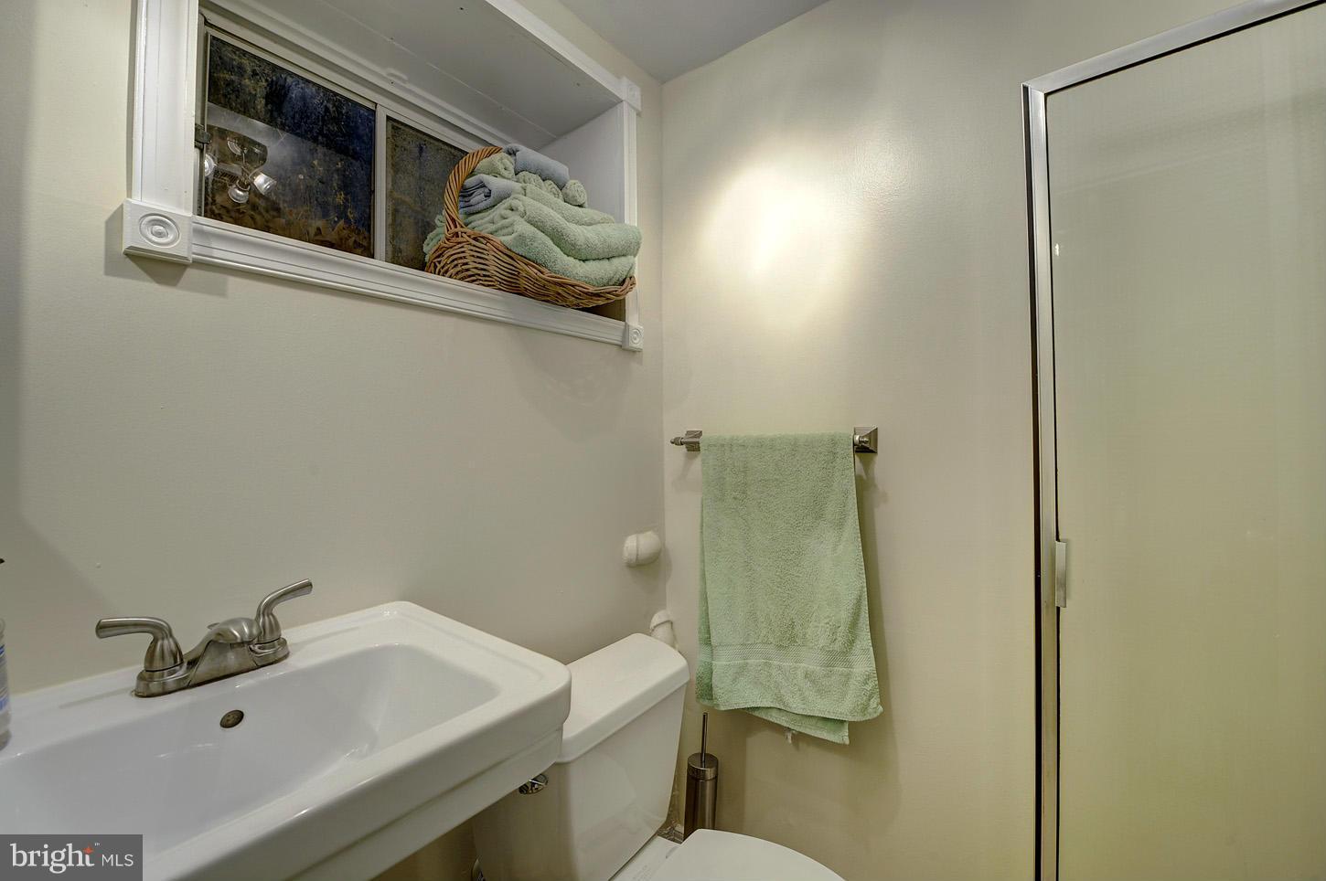 2908 Harris Avenue Silver Spring, MD 20902 - Photo 23 of 30 a bathroom with a sink and mirror