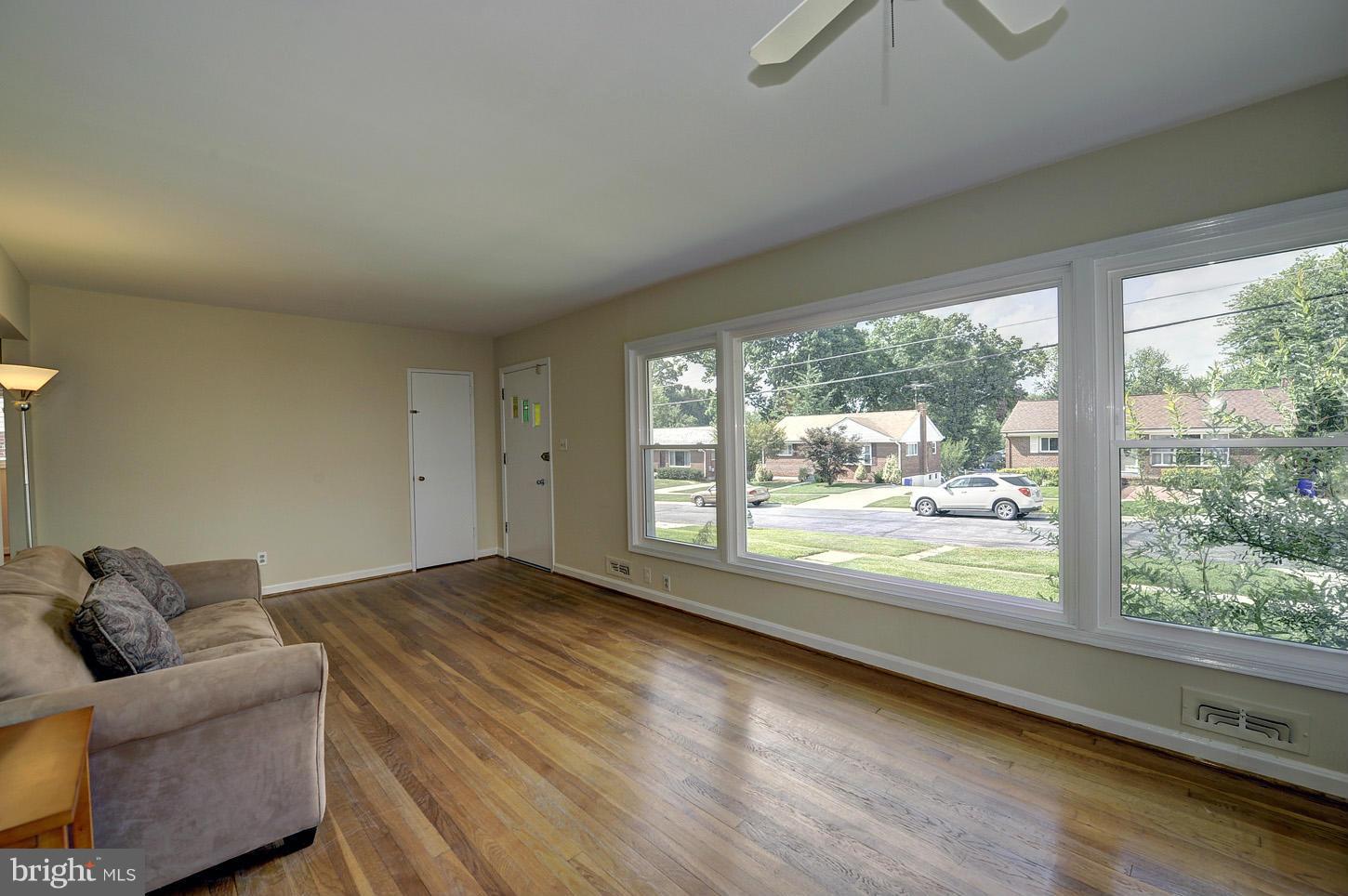 2908 Harris Avenue Silver Spring, MD 20902 - Photo 4 of 30 a living room with furniture and a floor to ceiling window