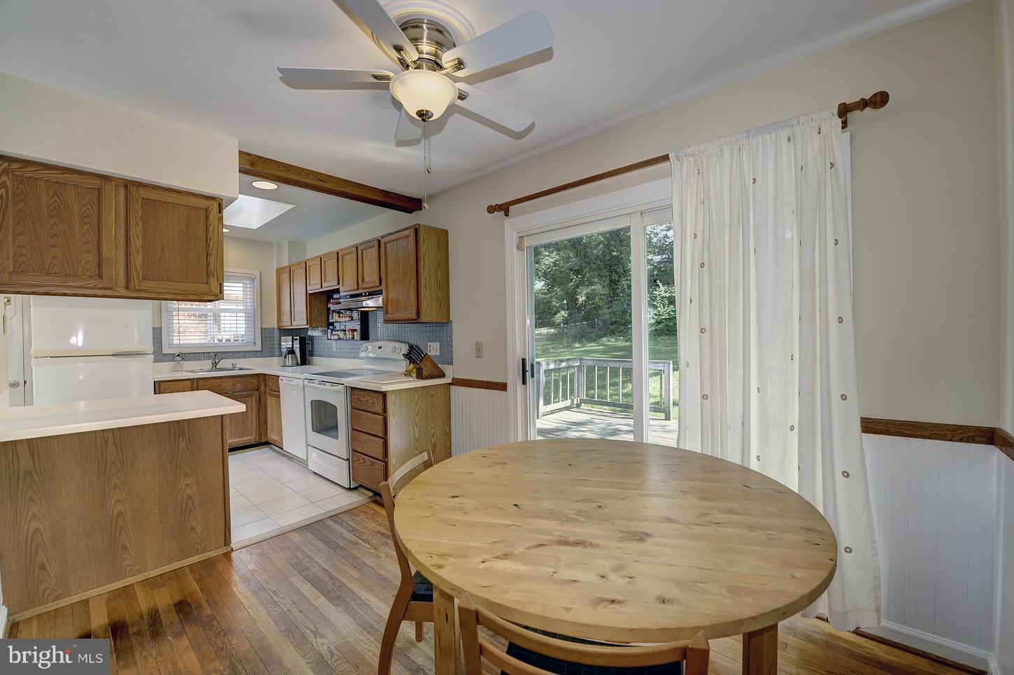 2908 Harris Avenue Silver Spring, MD 20902 - Photo 9 of 30 a kitchen with a table chairs microwave and cabinets