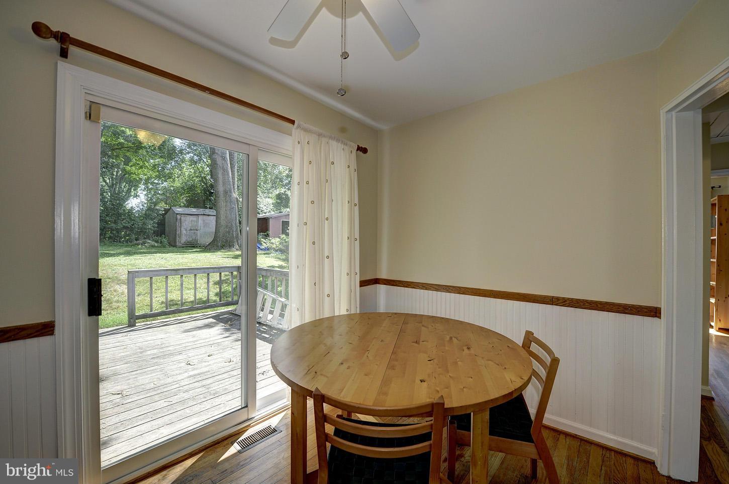 2908 Harris Avenue Silver Spring, MD 20902 - Photo 10 of 30 a view of a dining room with furniture window and wooden floor