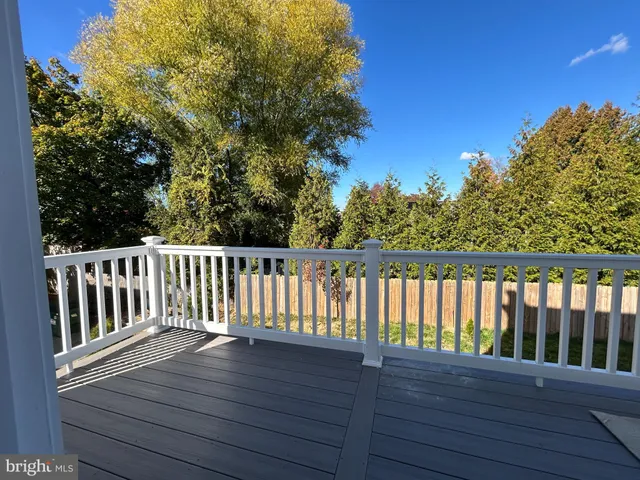 a view of balcony with wooden floor
