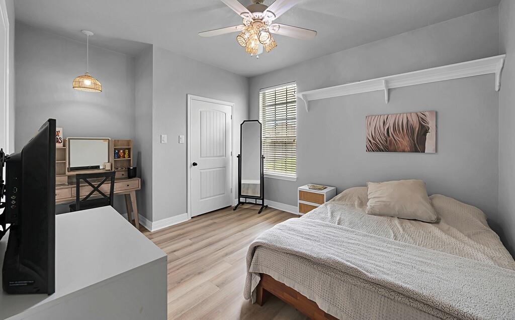 550 Hunton Lane Robinson, TX 76706 - Photo 25 of 35 Bedroom featuring light wood finished floors and ceiling fan