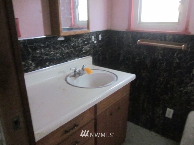 378 Boistfort Road Curtis, WA 98538 - Photo 11 of 18 a bathroom with a sink and a window