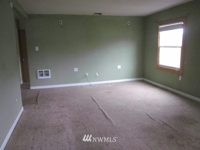 378 Boistfort Road Curtis, WA 98538 - Photo 3 of 18 a view of an empty room with a window