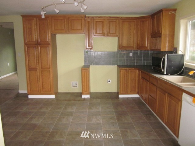378 Boistfort Road Curtis, WA 98538 - Photo 4 of 18 a kitchen with stainless steel appliances a refrigerator and a stove