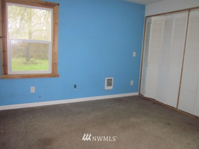 378 Boistfort Road Curtis, WA 98538 - Photo 9 of 18 an empty room with windows
