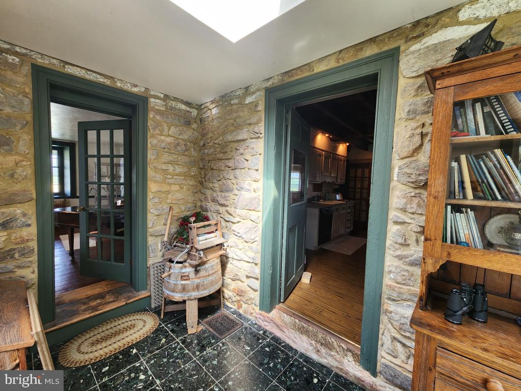 736 Strasburg Road Paradise, PA 17562 - Photo 58 of 87 a view of a hallway with wooden floor and a book shelf