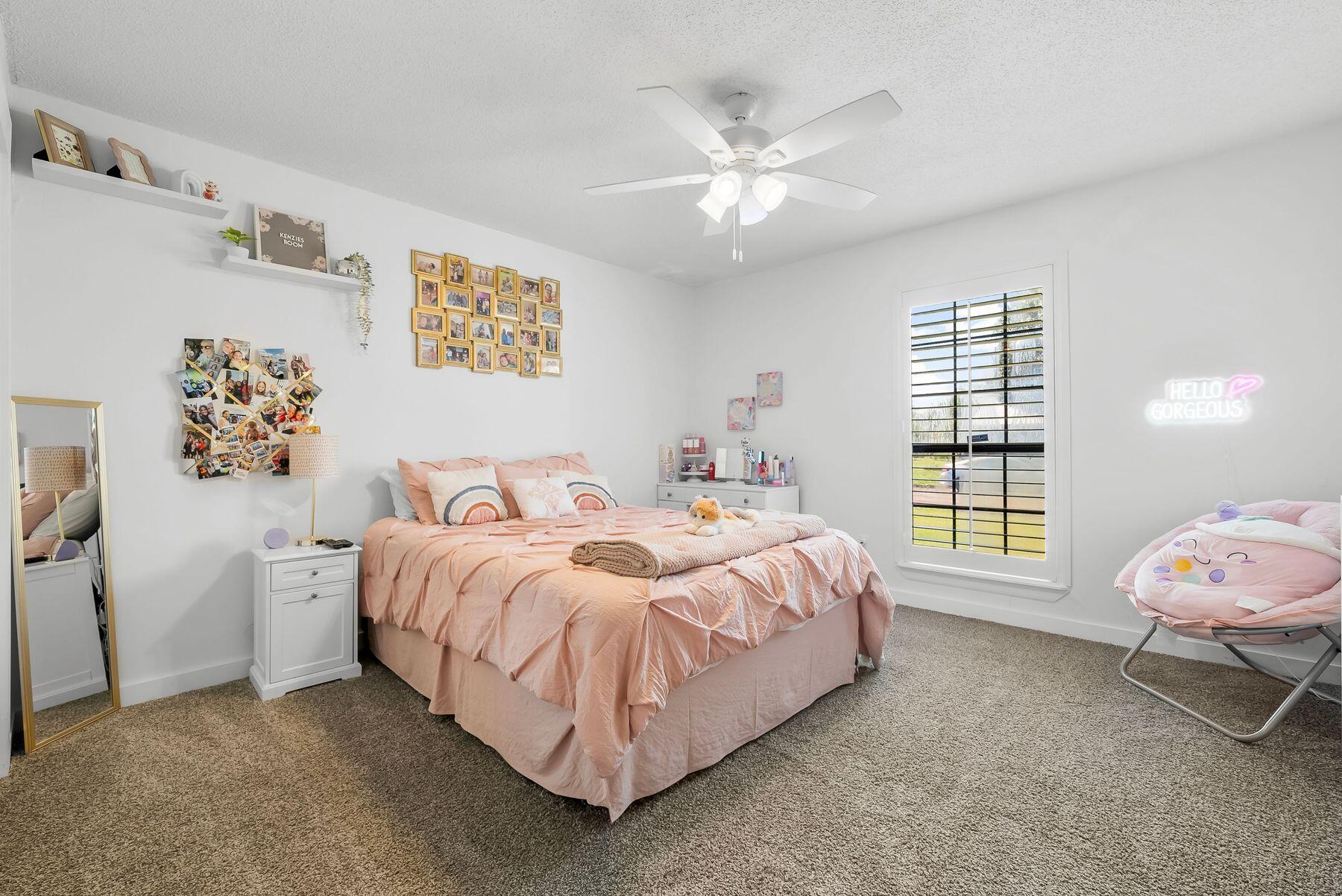 1218 Tuscany Road Panama City, FL 32405 - Photo 25 of 34 a bedroom with a bed and a window