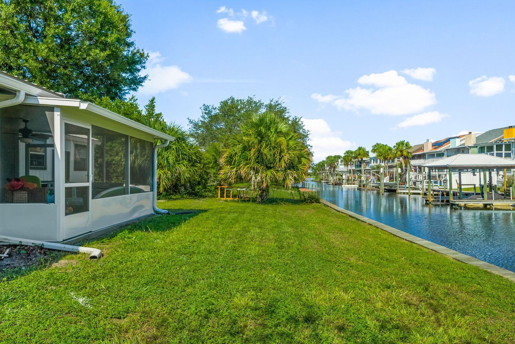 1218 Tuscany Road Panama City, FL 32405 - Photo 31 of 34 a view of swimming pool with garden and trees