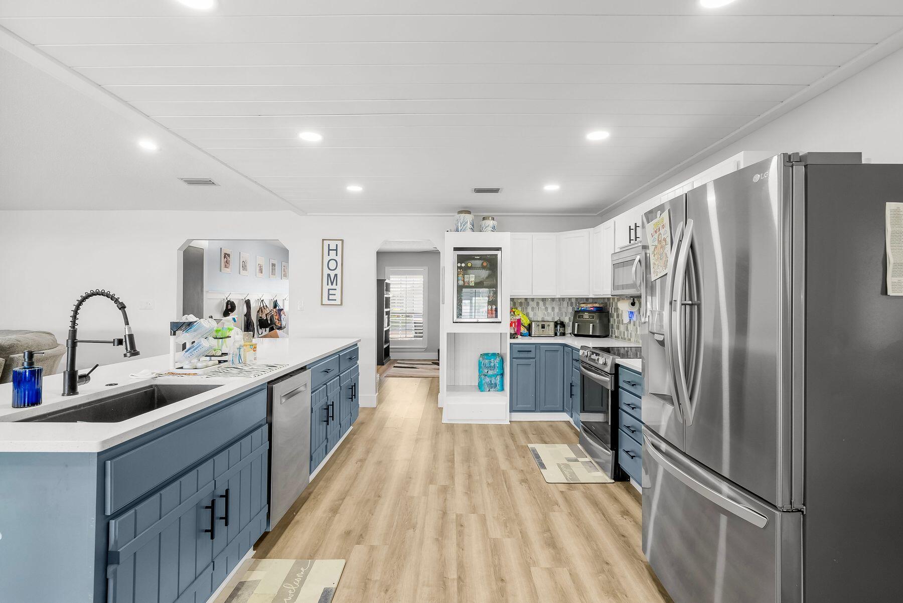 1218 Tuscany Road Panama City, FL 32405 - Photo 10 of 34 a kitchen with refrigerator and cabinets