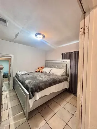 a bedroom with a bed and a shower