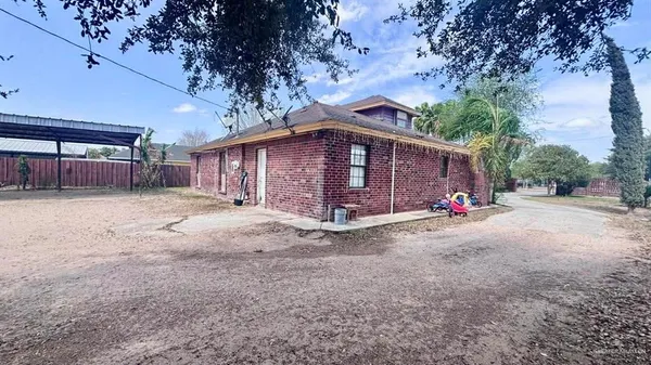 a view of a house with a yard and garage