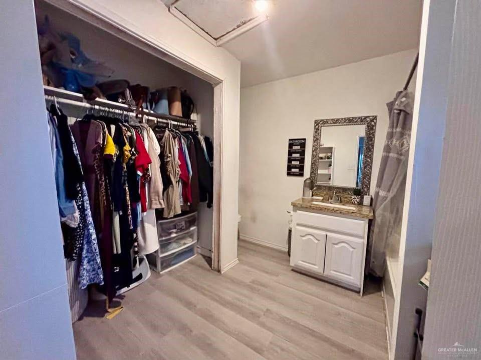 3113 Pradera Street Mission, TX 78574 - Photo 8 of 20 a view of walk in closet with clothes and shoes