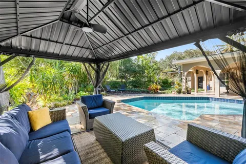 a view of an outdoor sitting area with furniture