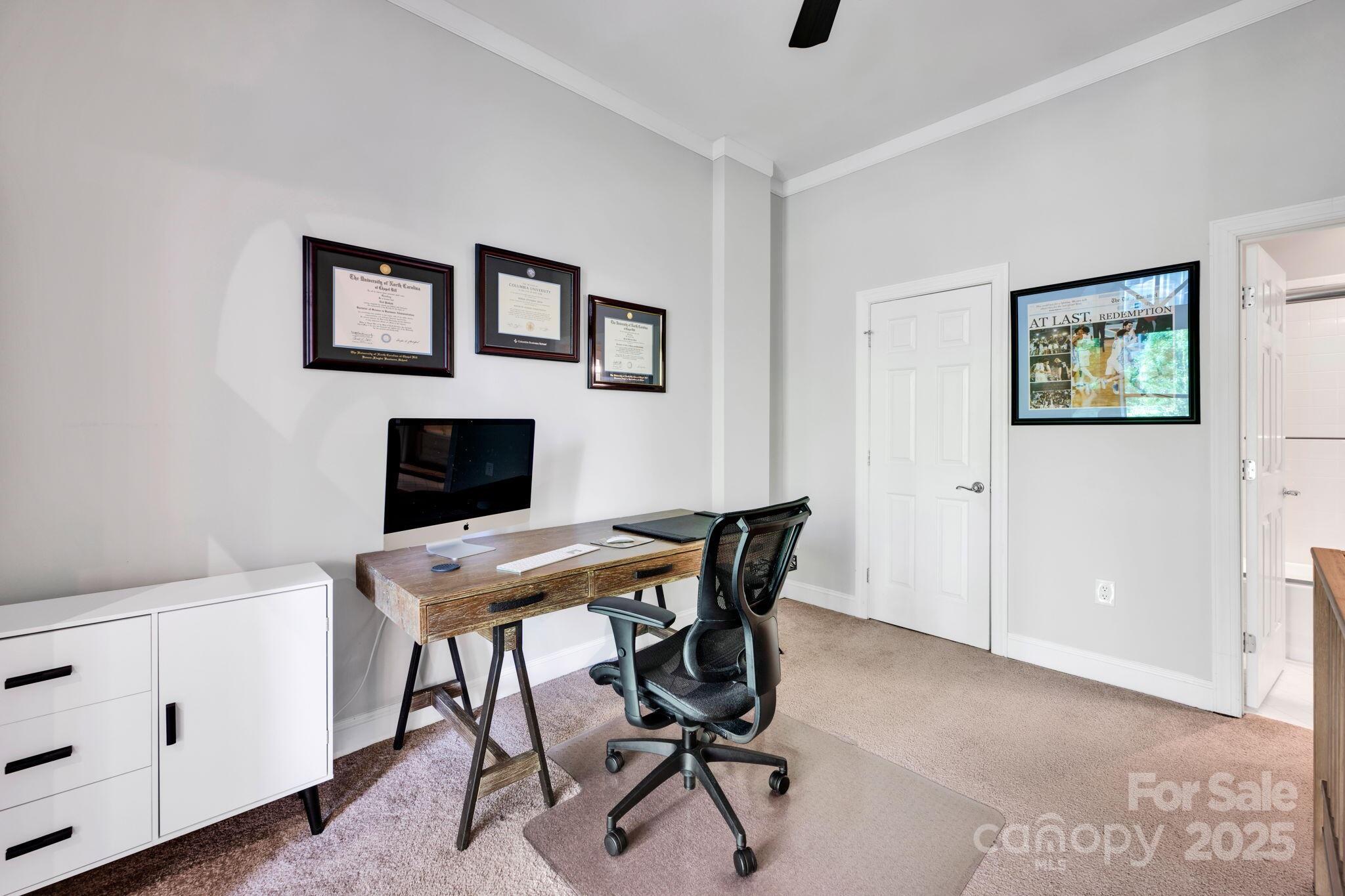 127 North Tryon Street, Unit 404 Charlotte, NC 28246 - Photo 16 of 22 a view of a workspace with furniture