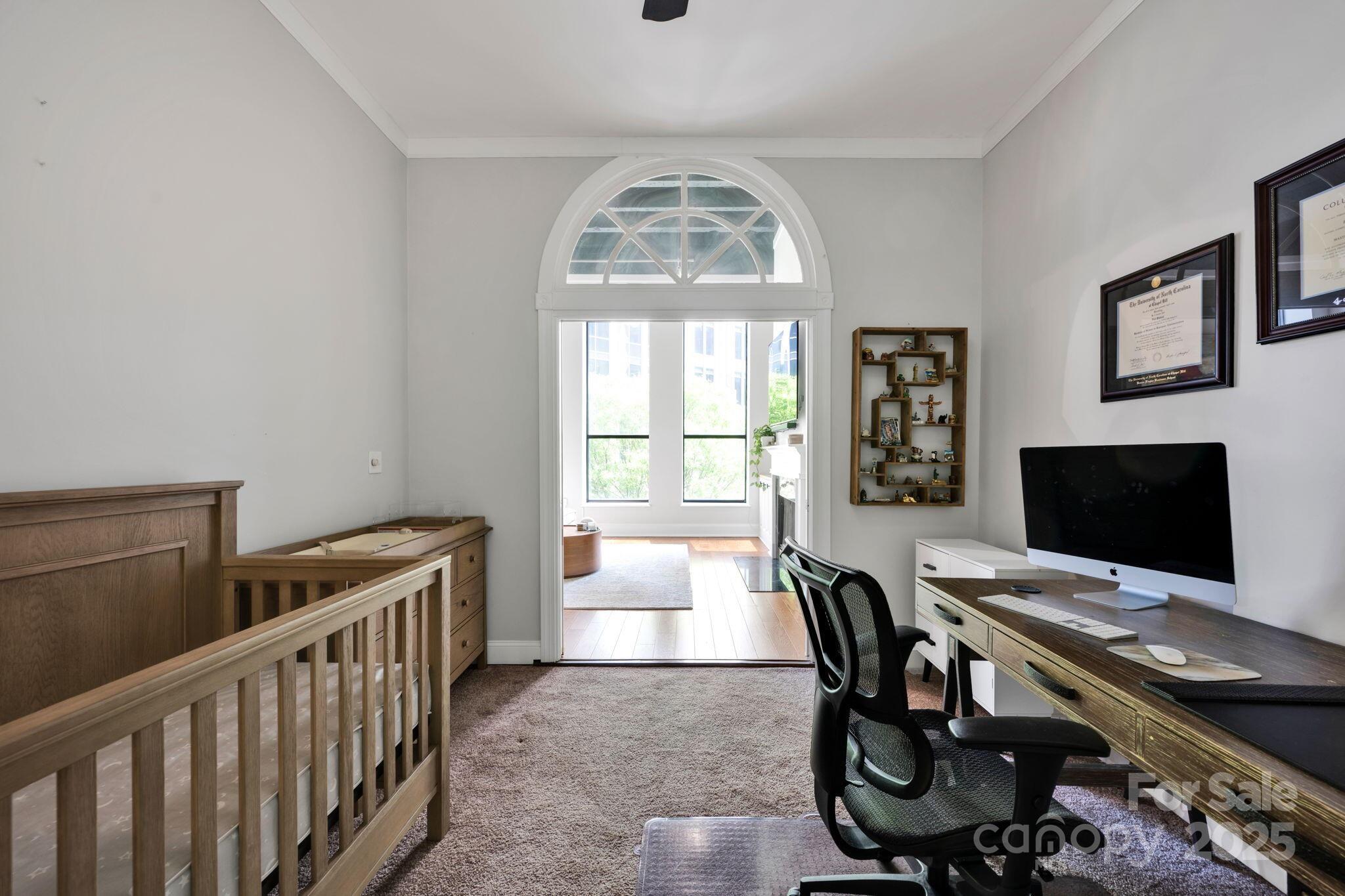 127 North Tryon Street, Unit 404 Charlotte, NC 28246 - Photo 17 of 22 a workspace with furniture and a window
