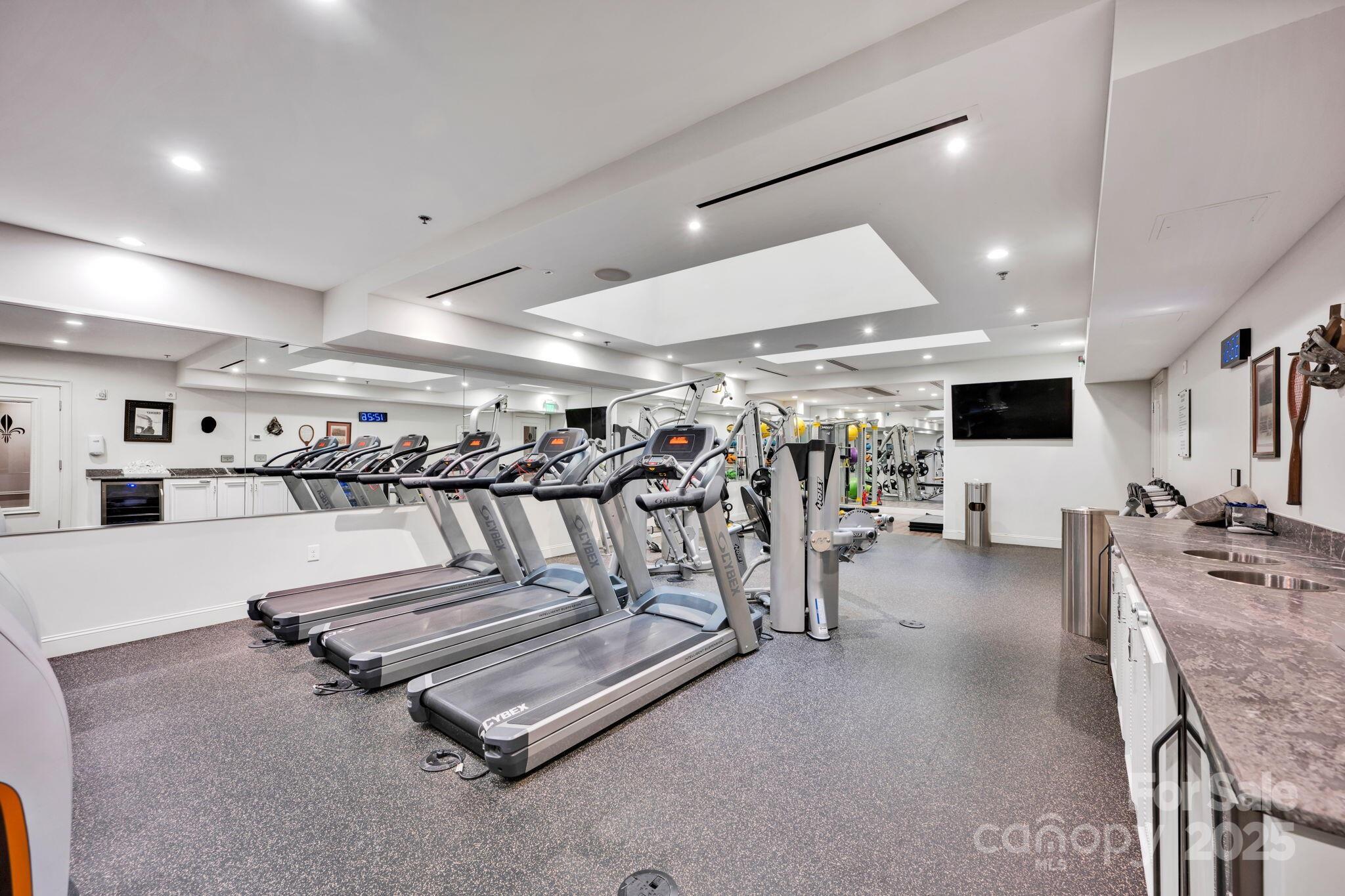 127 North Tryon Street, Unit 404 Charlotte, NC 28246 - Photo 20 of 22 a view of a room with gym equipment